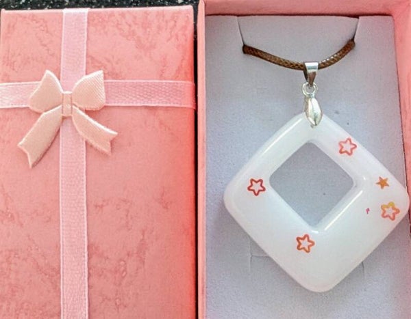 Diamond shaped white resin pendant with gold glitter stars