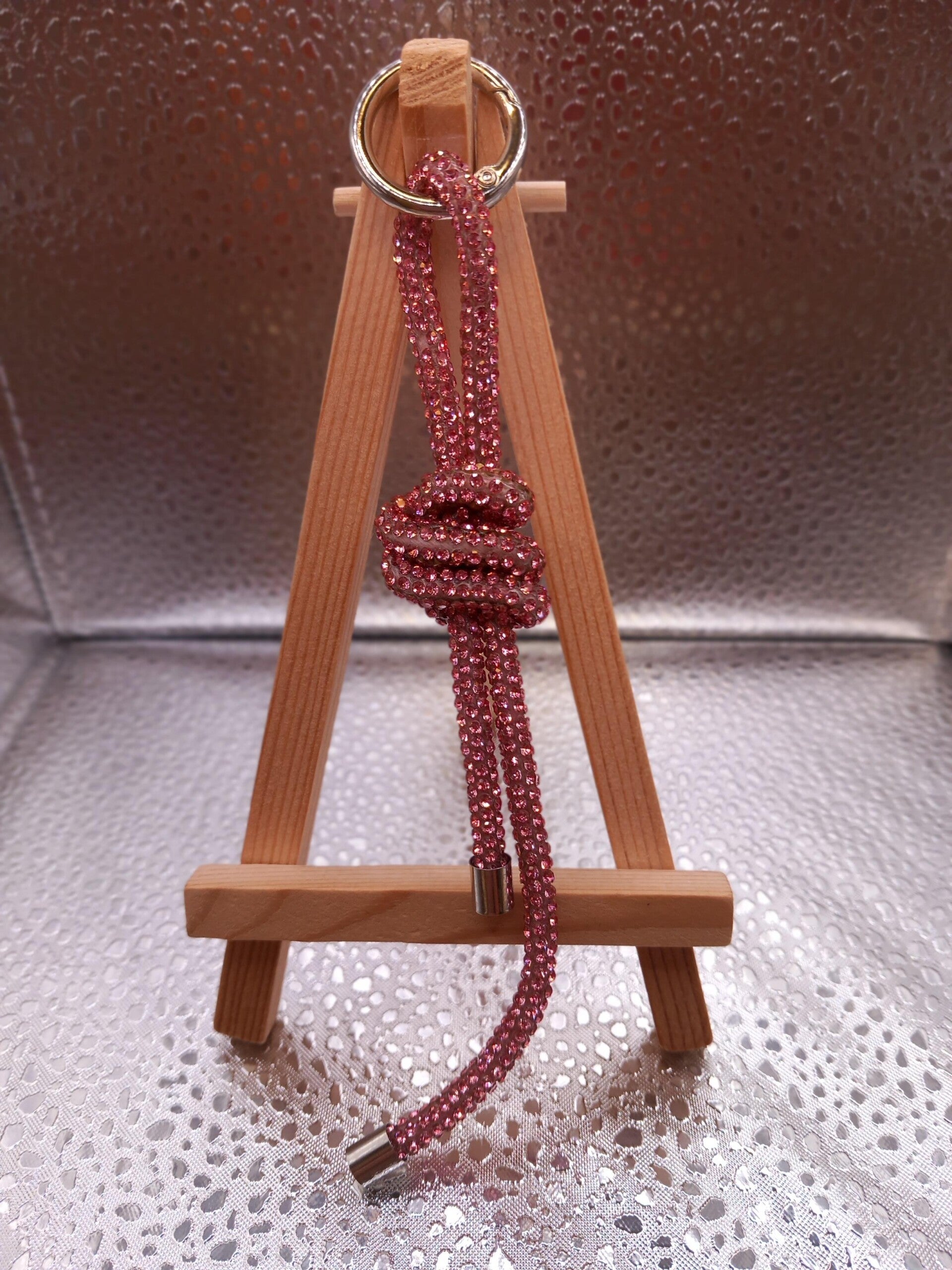 Telefoonkoord knoop roze