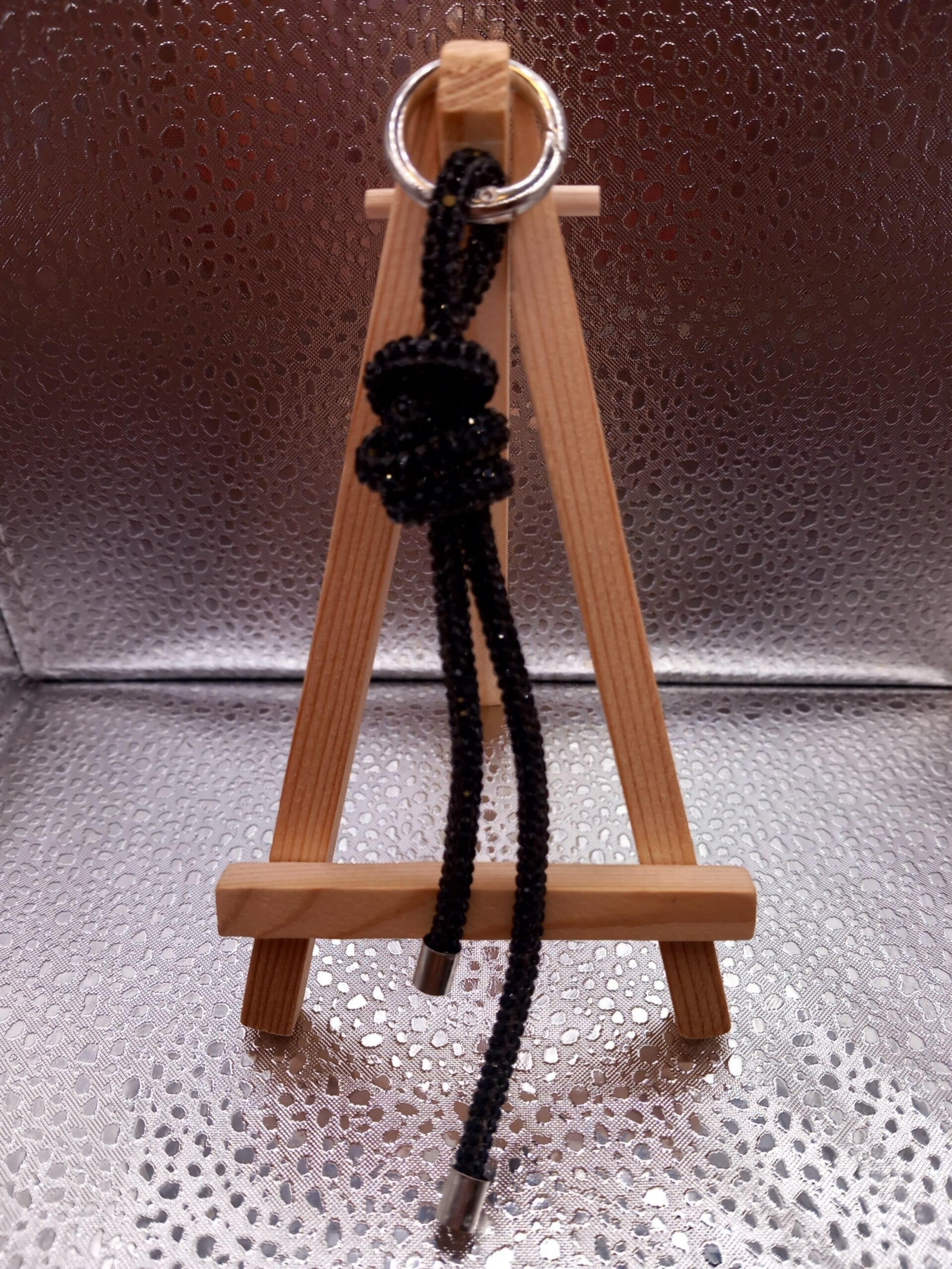 Telefoonkoord knoop zwart