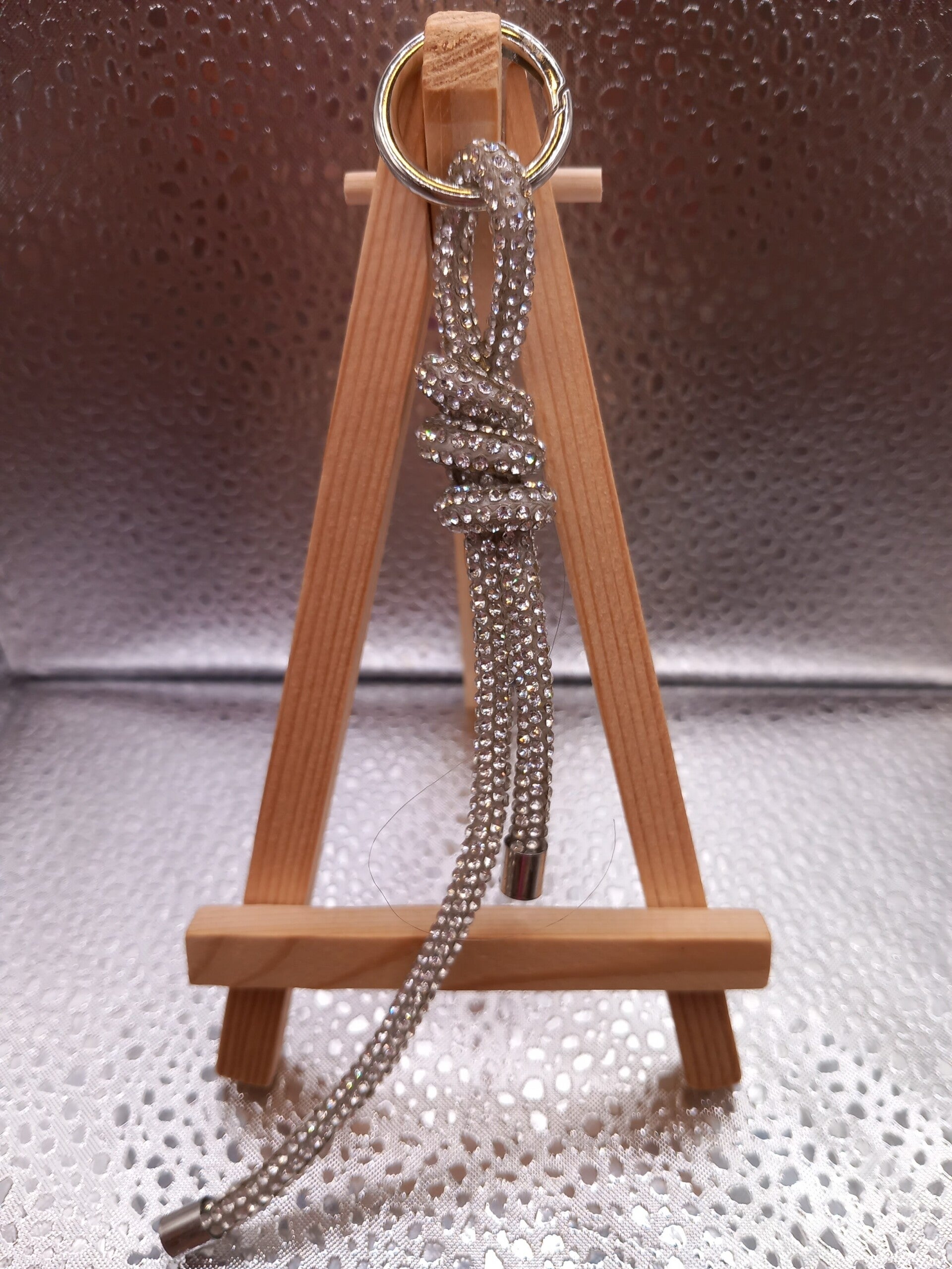 Telefoonkoord knoop zilver