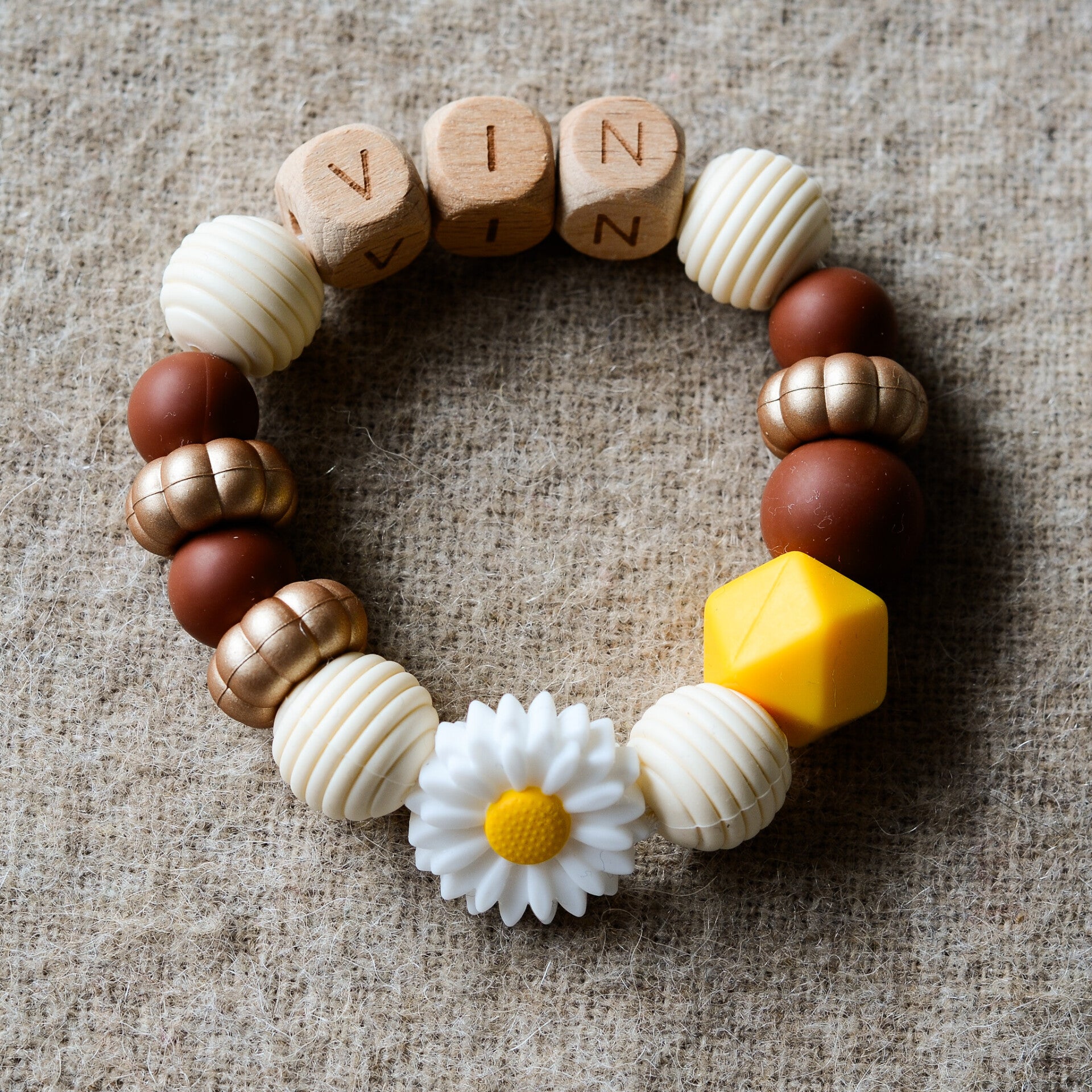 Bijtring met naam - Warme kleuren