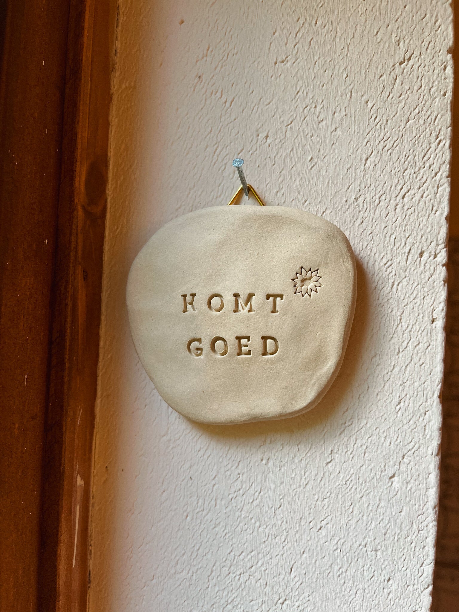 muurhanger alles komt goed