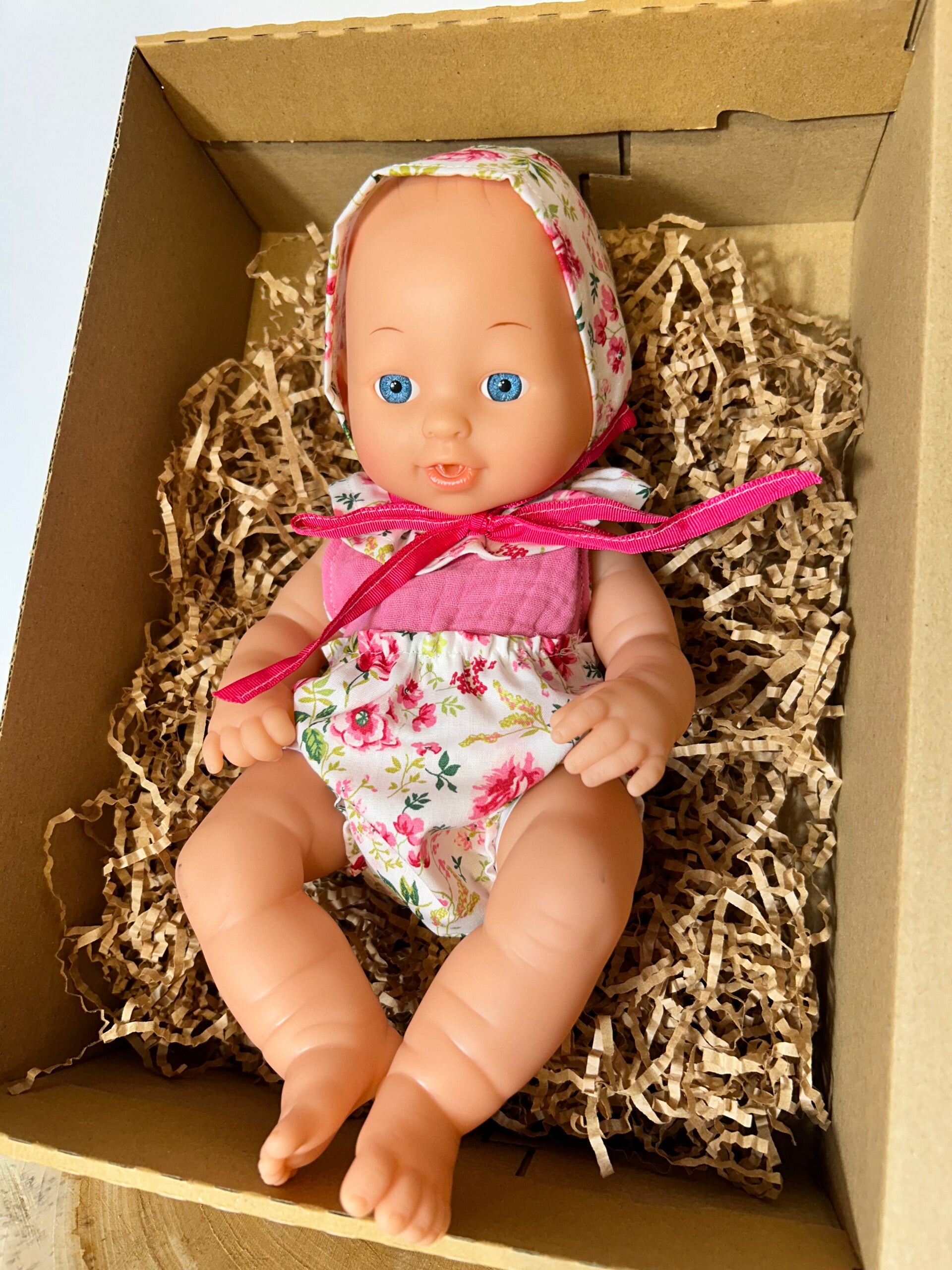 Muñeca flores rosas