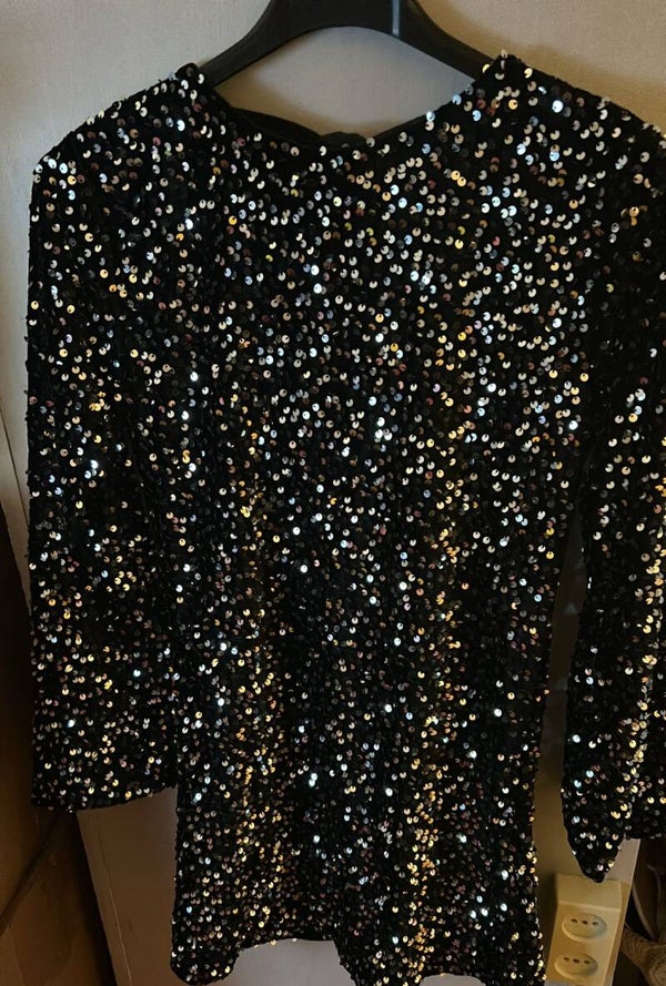 Zilver glitterjurk met strik op de rug