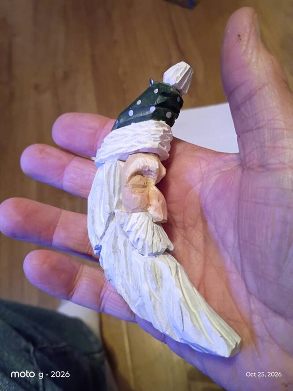 Half moon sleeping Santa with green hat.