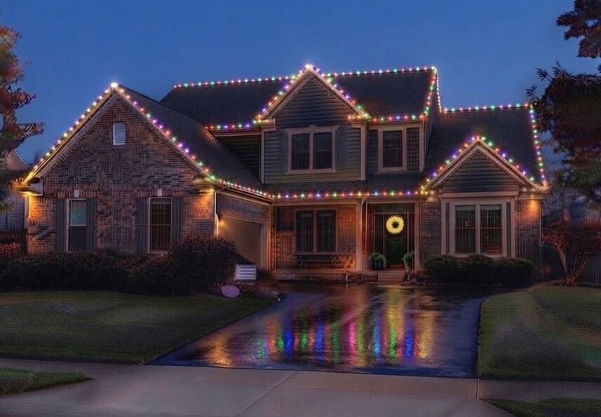 Seasonal Christmas light installation on a Cincinnati home with illuminated roofline