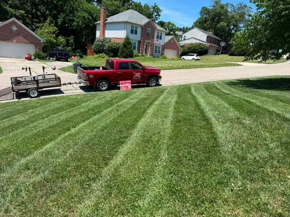 Professional lawn mowing and sharp, clean striping on a residential property in Cincinnati, Ohio.