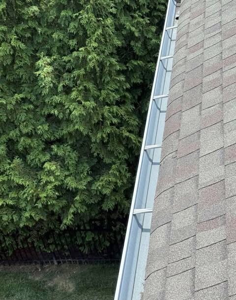 Professional residential gutter cleaning and debris removal in Sharonville, Ohio by Nienaber And Sons Lawn Care.