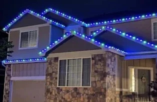 Holiday lighting installation in Cincinnati, Ohio, featuring a professionally illuminated home
