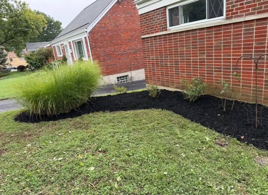 West Chester Township Ohio landscape beds after weed removal and fresh mulch installation
