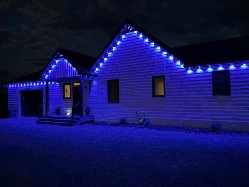 Custom residential holiday lighting display installed by Nienaber And Sons Lawn Care in Cleves, Ohio