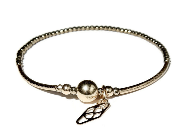 flexbracelet 2 mm Hematite patterned tubes and shiny goldfilled bead BF3163