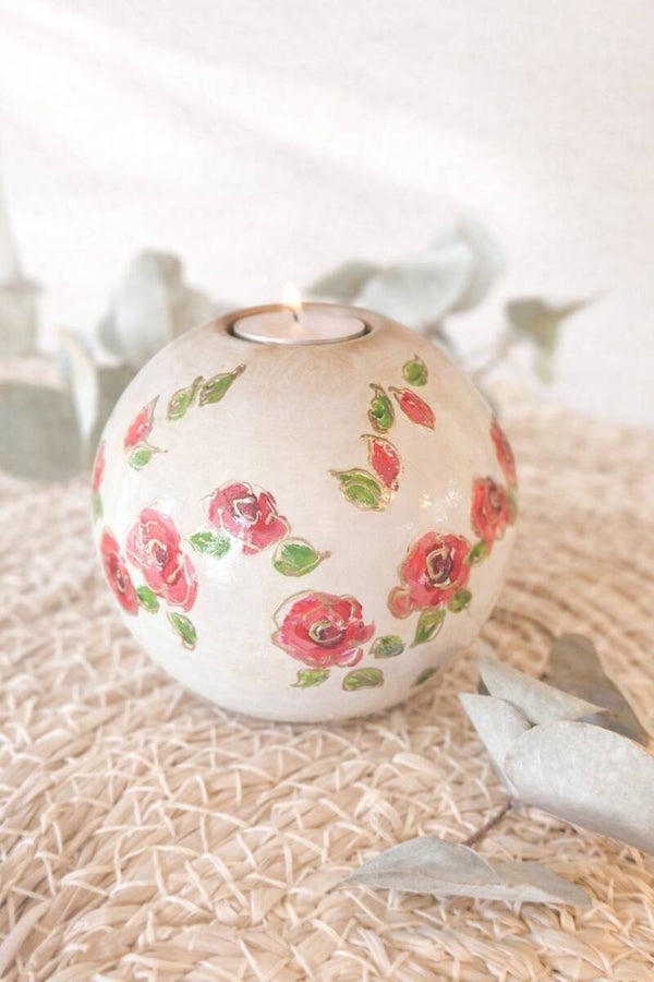 Urn waxine licht met rozen