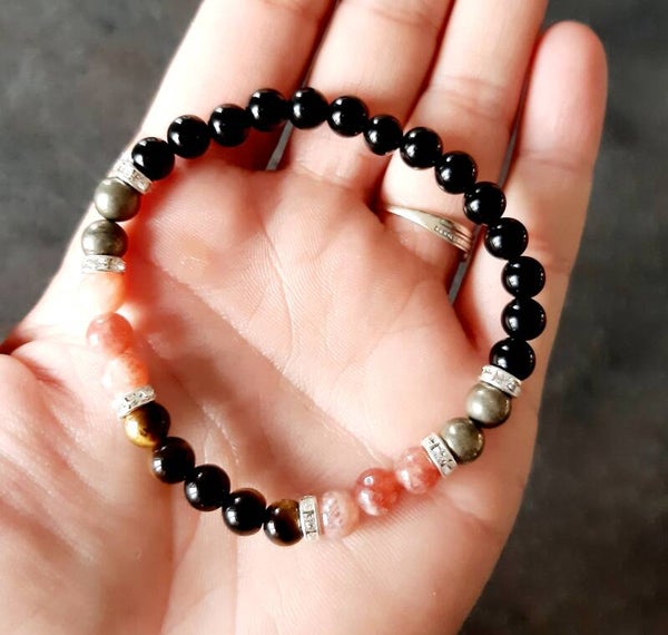 Bracelet tourmaline, pierre de soleil, pyrite, œil de tigre, separateur acier