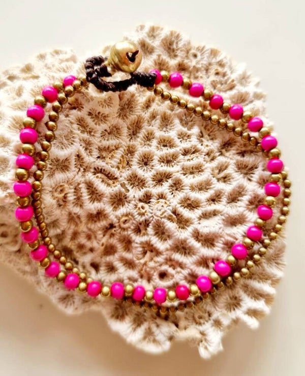 Armbandje goud / fuchsia roze