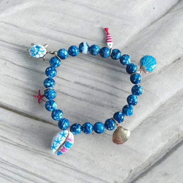 Beache armbandje rode vis