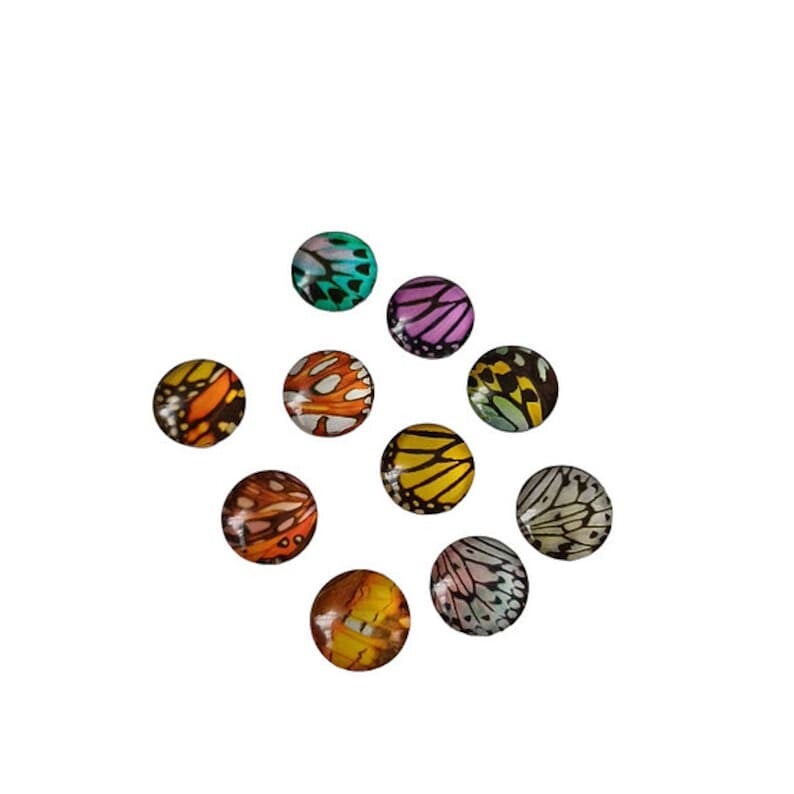 Cabochon rond en verre aile de papillon