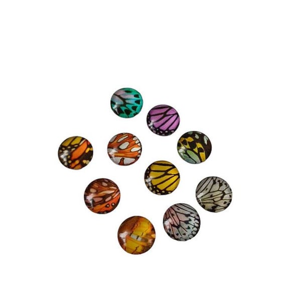 Cabochon rond en verre aile de papillon