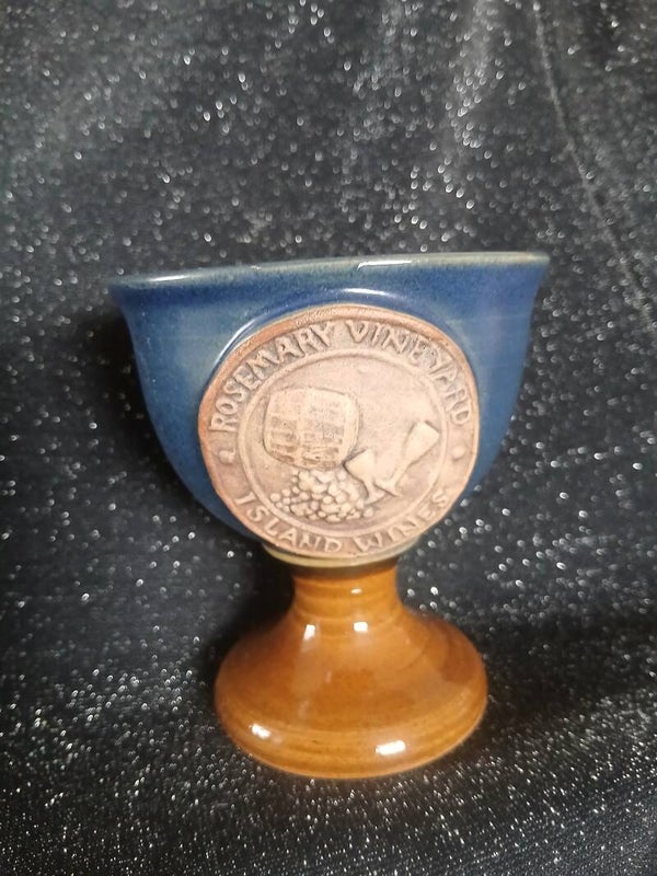 Vintage stoneware chalice cup with a beige face