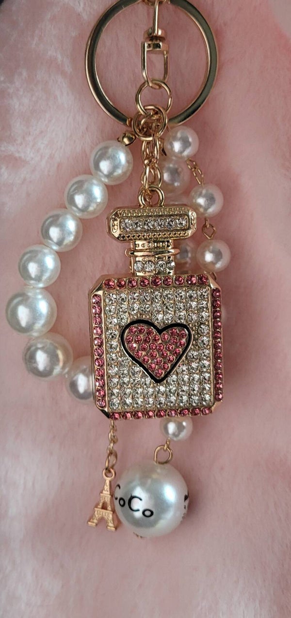 Luxe hanger met roze randen parfumflesje