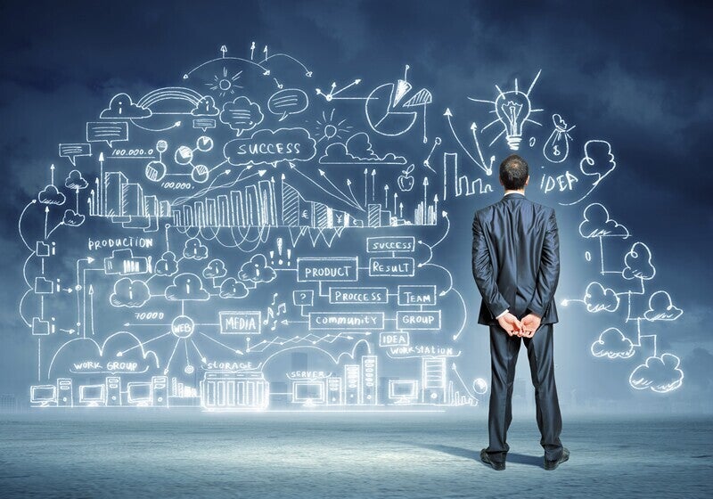 Man studying a collage of images and notes