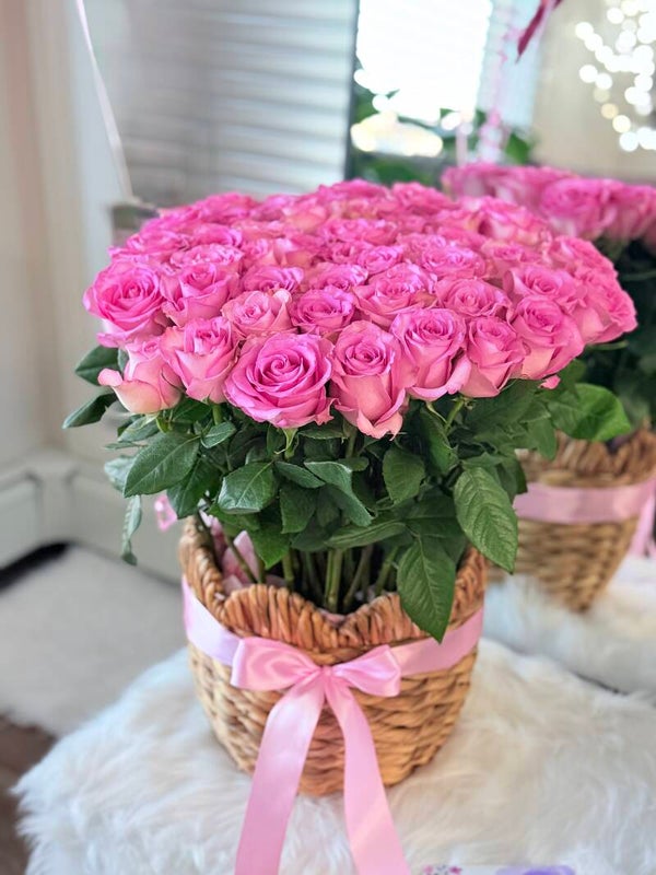 A blooming basket of 50 pink roses.