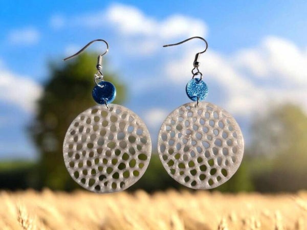 3D Printed White Hole Earrings with Blue Dot