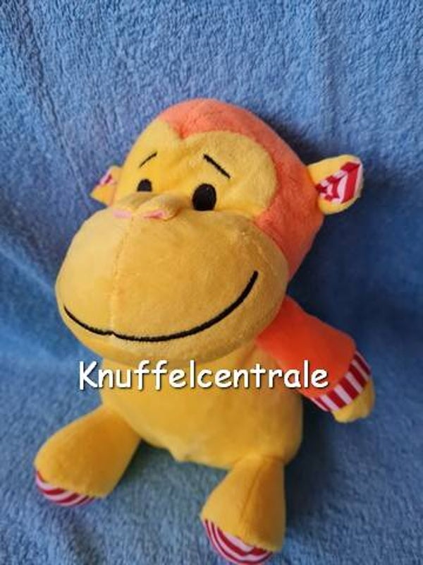 Inspirion GmbH aap knuffel zittend