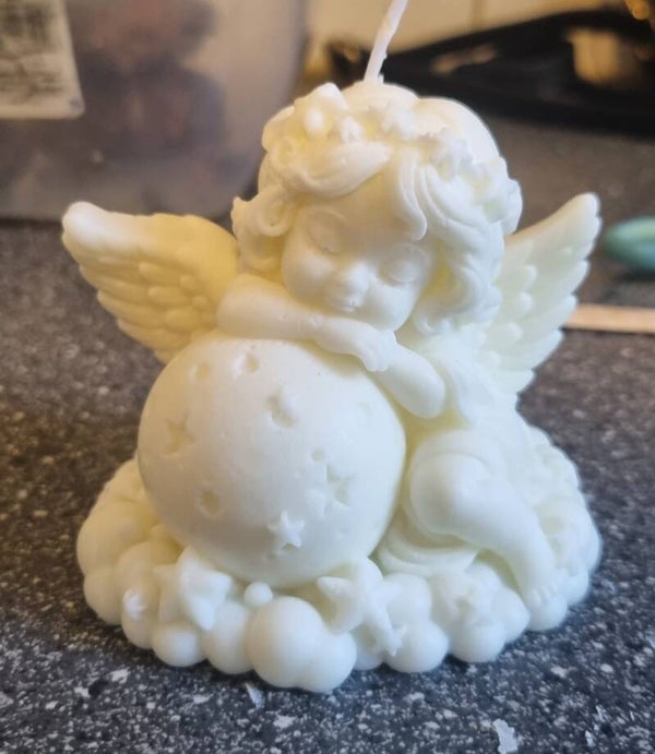 Engel met sterren bol