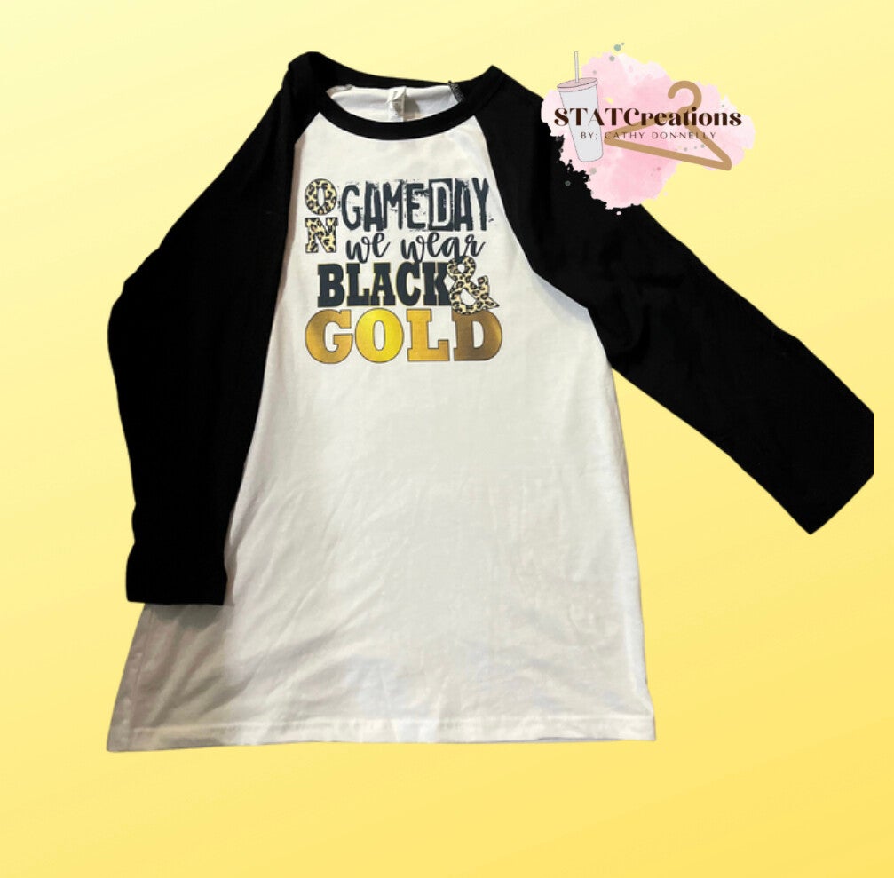 On game day we wear black and gold raglan