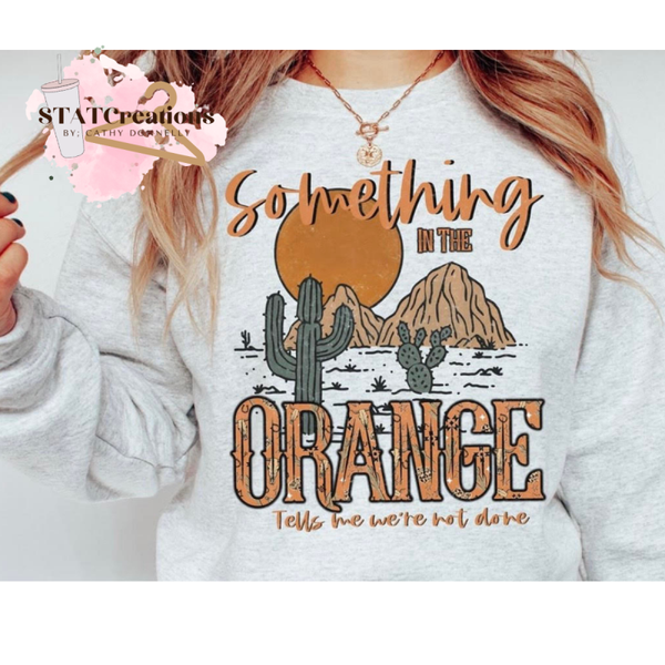 Something in the orange crewneck