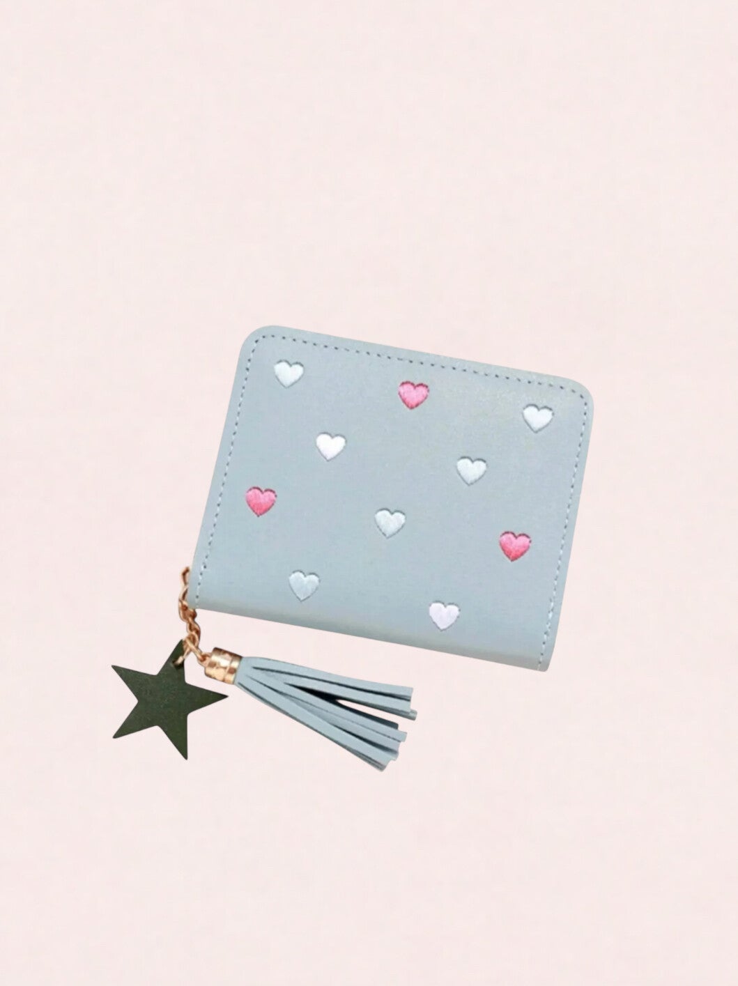 Lichtblauwe portemonnee met hartjes, franje kwastje en sterhanger