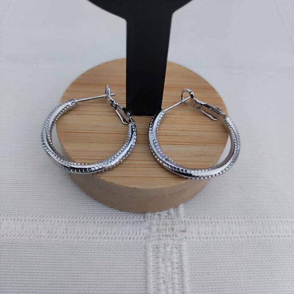 Boucles d'oreilles créoles torsadé argenté