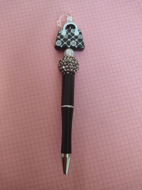 Black purse pen