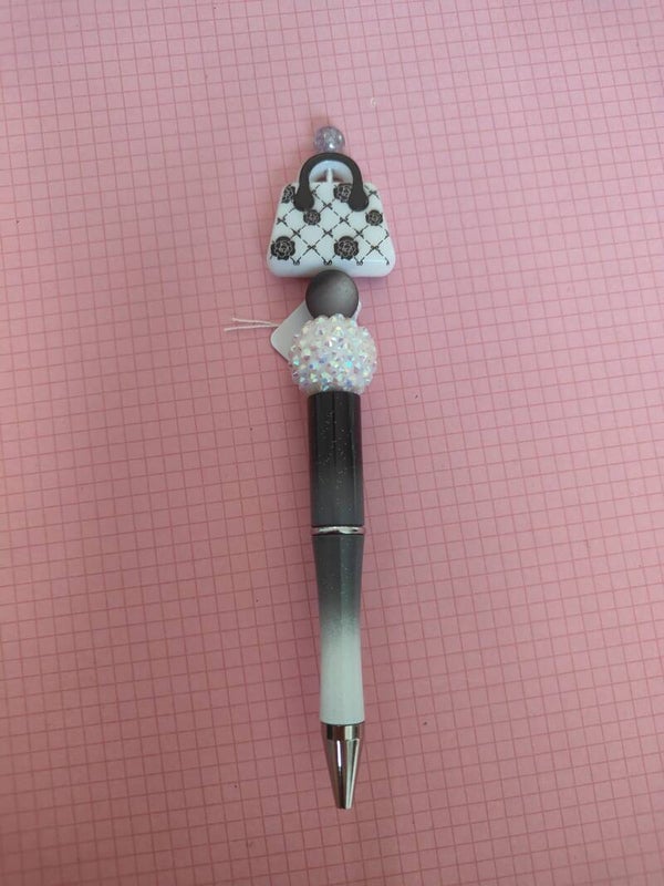 White purse pen