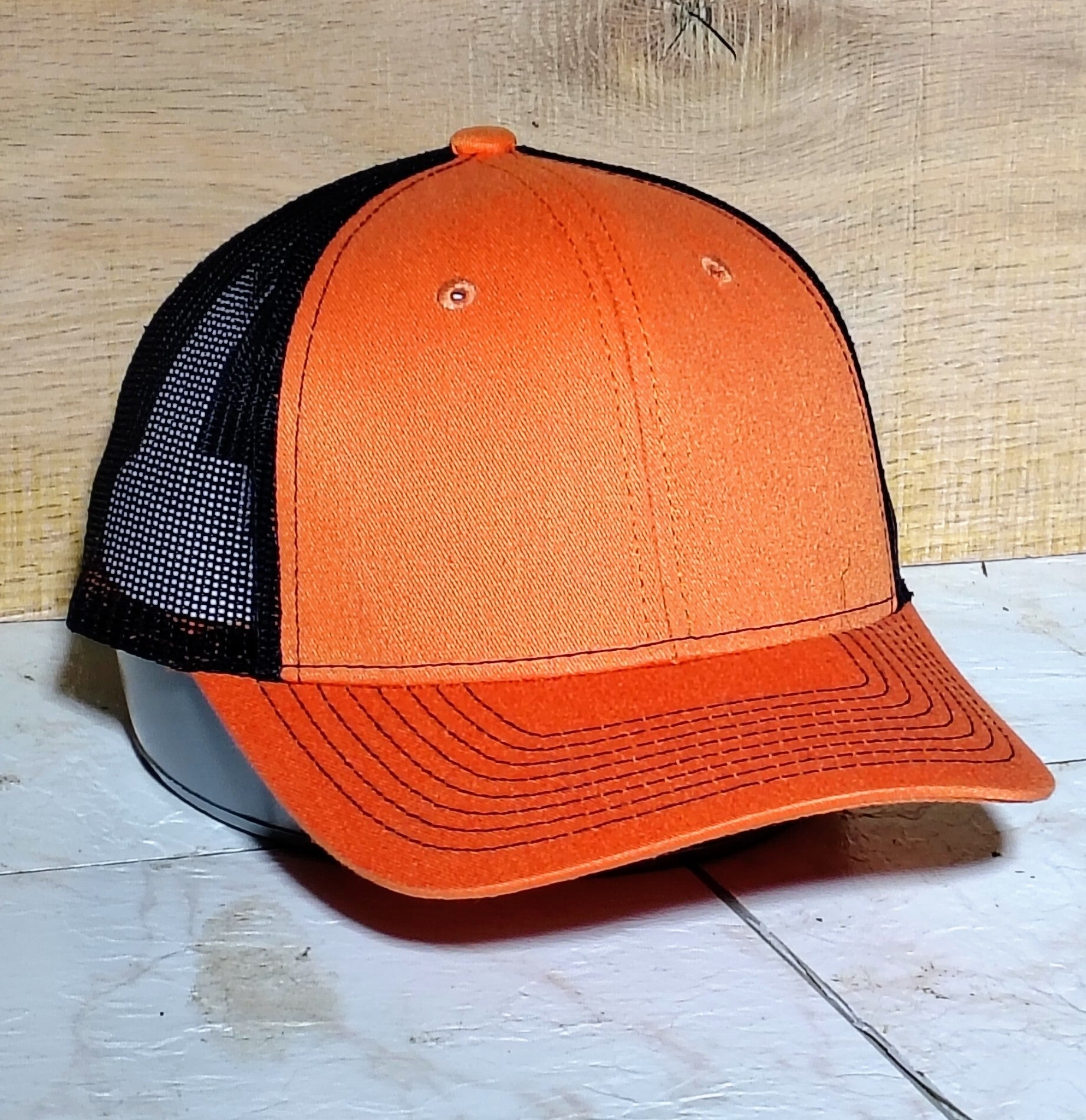 Orange/black trucker