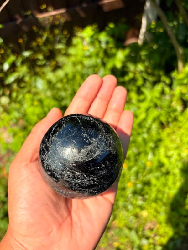Black tourmaline sphere ball protection 593g comes on wood stand