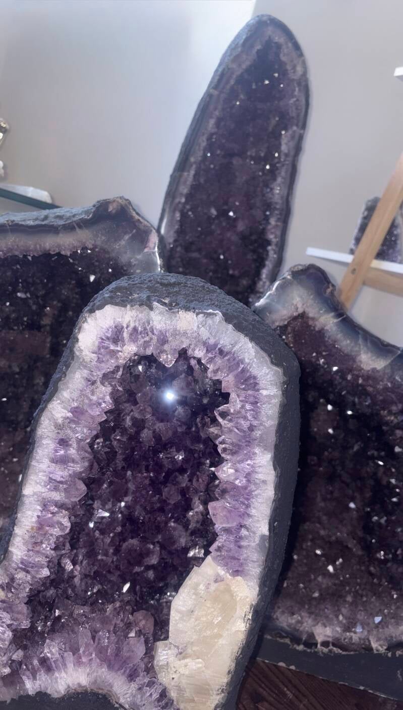 A collection of four large natural Amethyst cathedral geodes and crystal clusters from TTRS Crystals