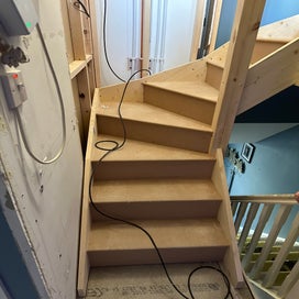 Stairs being installed into what used to be the boiler cupboard 