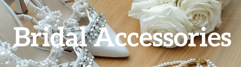 A beautifully arranged wedding scene with bridal shoes, classic white roses, and elegant pearl jewelry