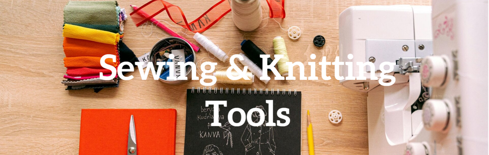 A creative workspace with essential sewing tools—machine, thread, material, and scissors ready for crafting.