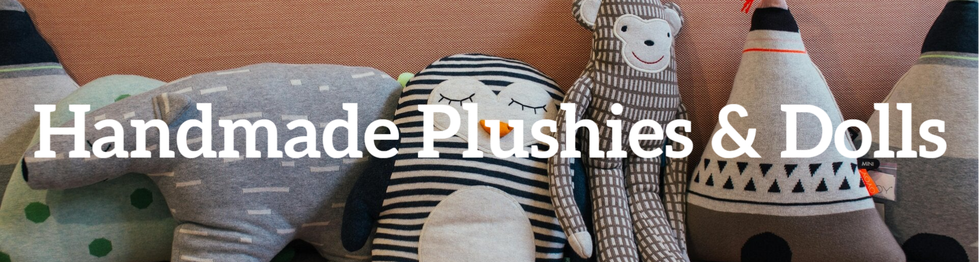 An artistic display of handcrafted plush toys and dolls, highlighting creativity and skill.