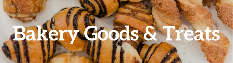 A warm and inviting display of baked treats, featuring golden-brown pastries and sweet confections.