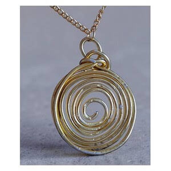 Gold circular hand hammered pendant