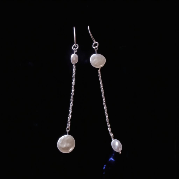 On tend mis matched pearl earrings