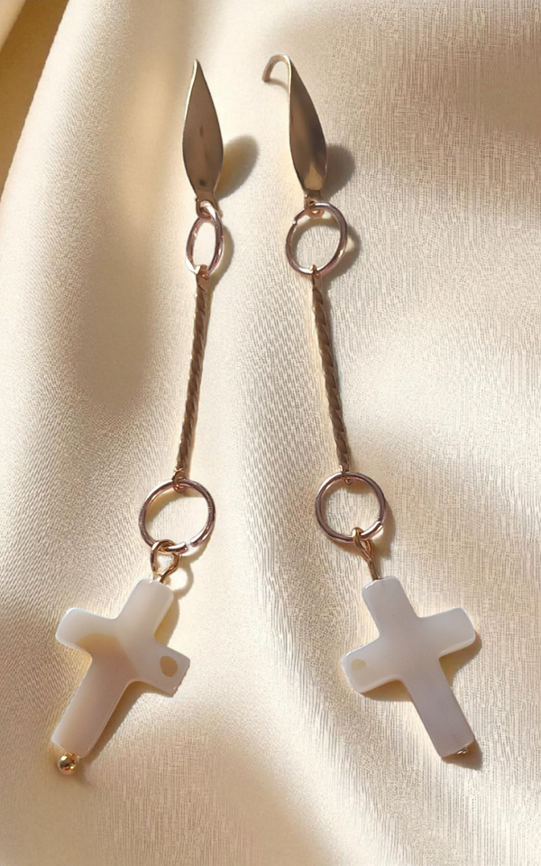 Faux ivory dangly cross earrings