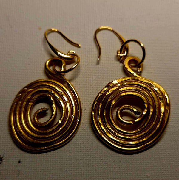 Gold tone hammered earrings.