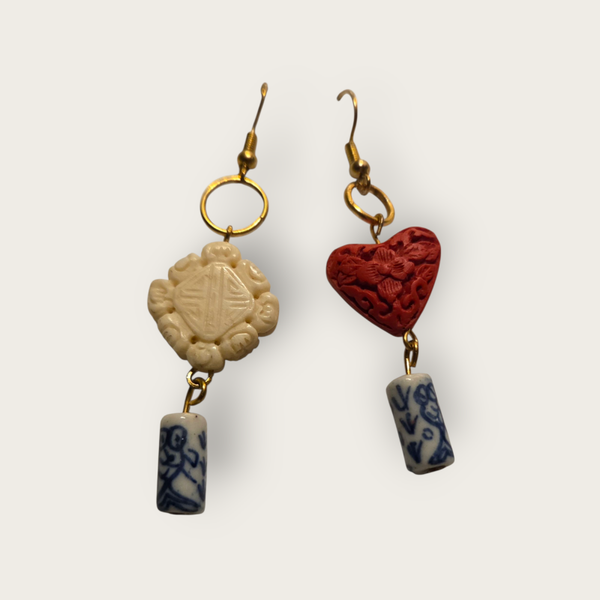 Drop earrings with charms