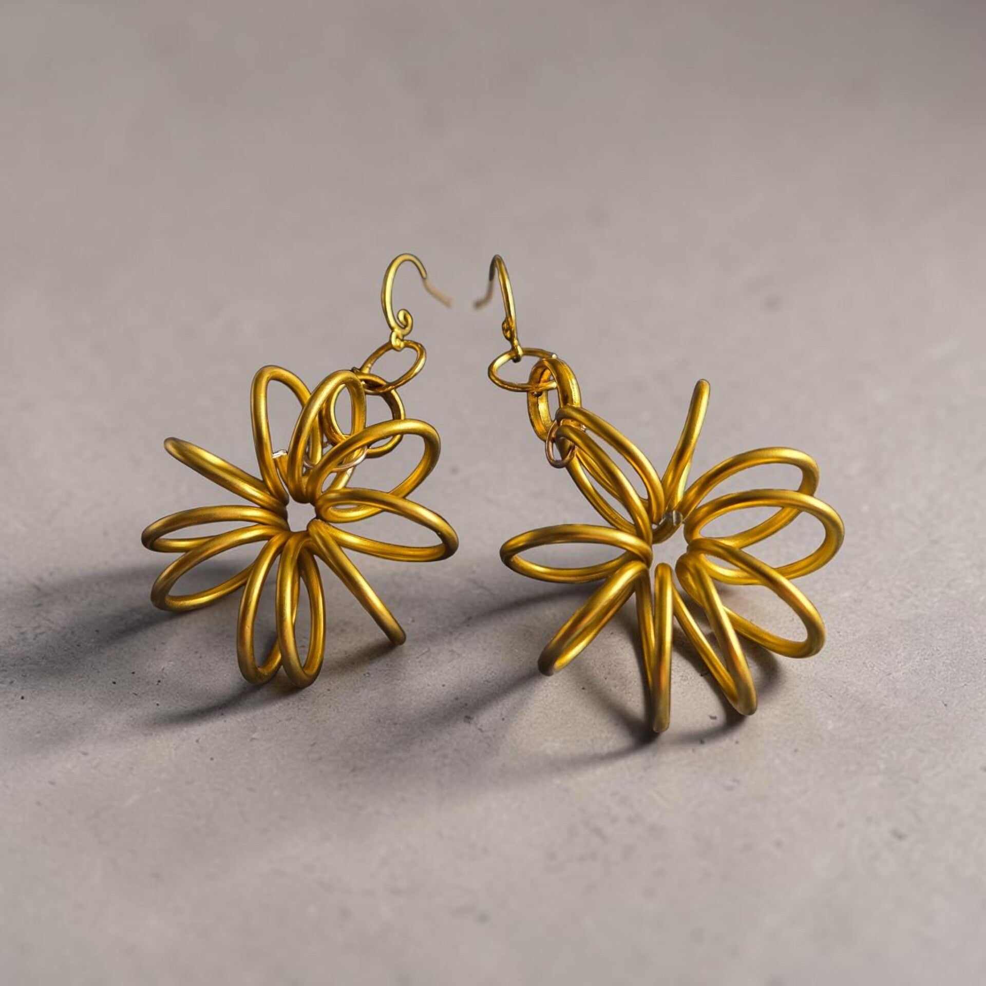 Unusual large gold toned earrings