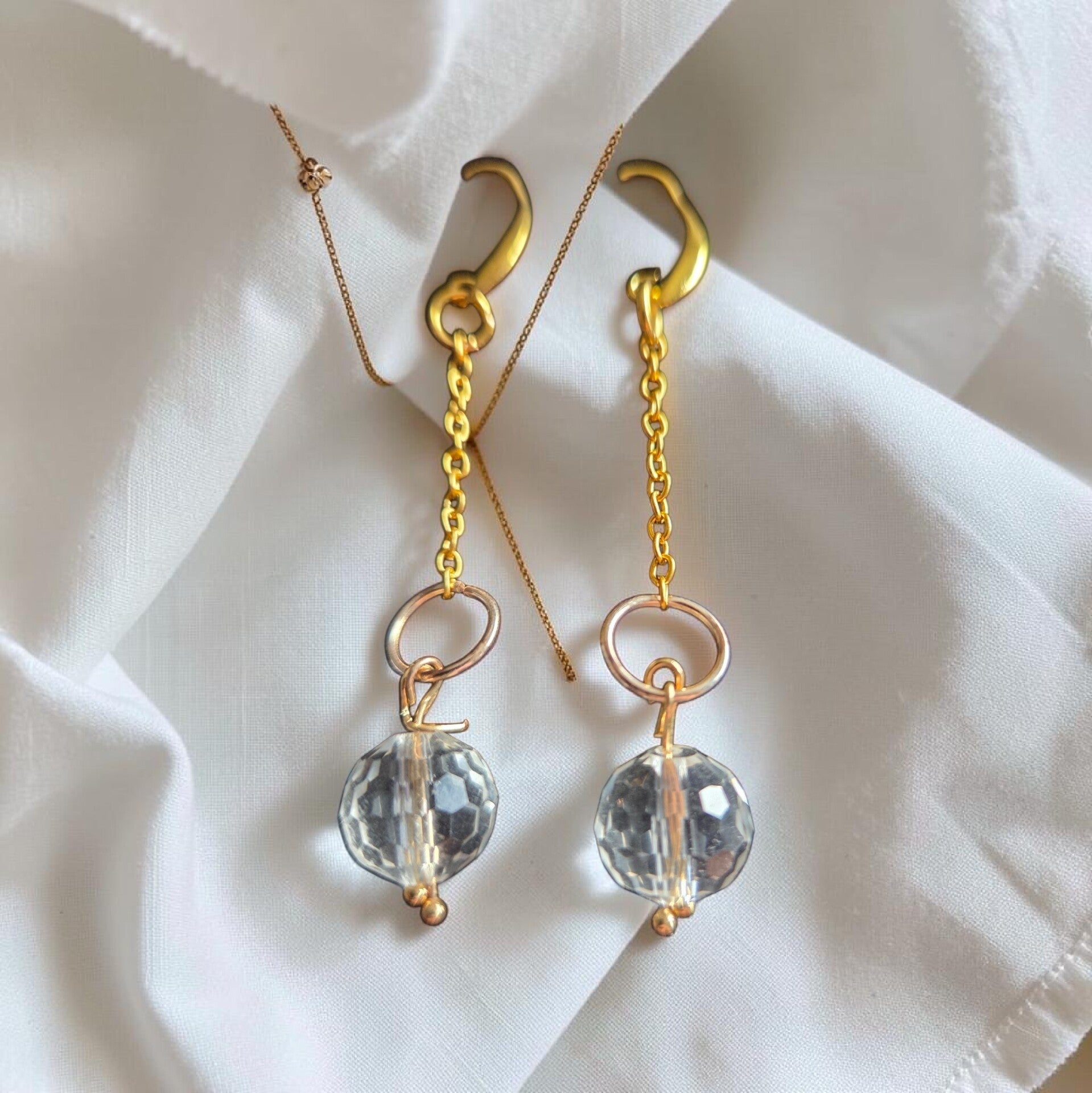 Crystal and gold toned earrings